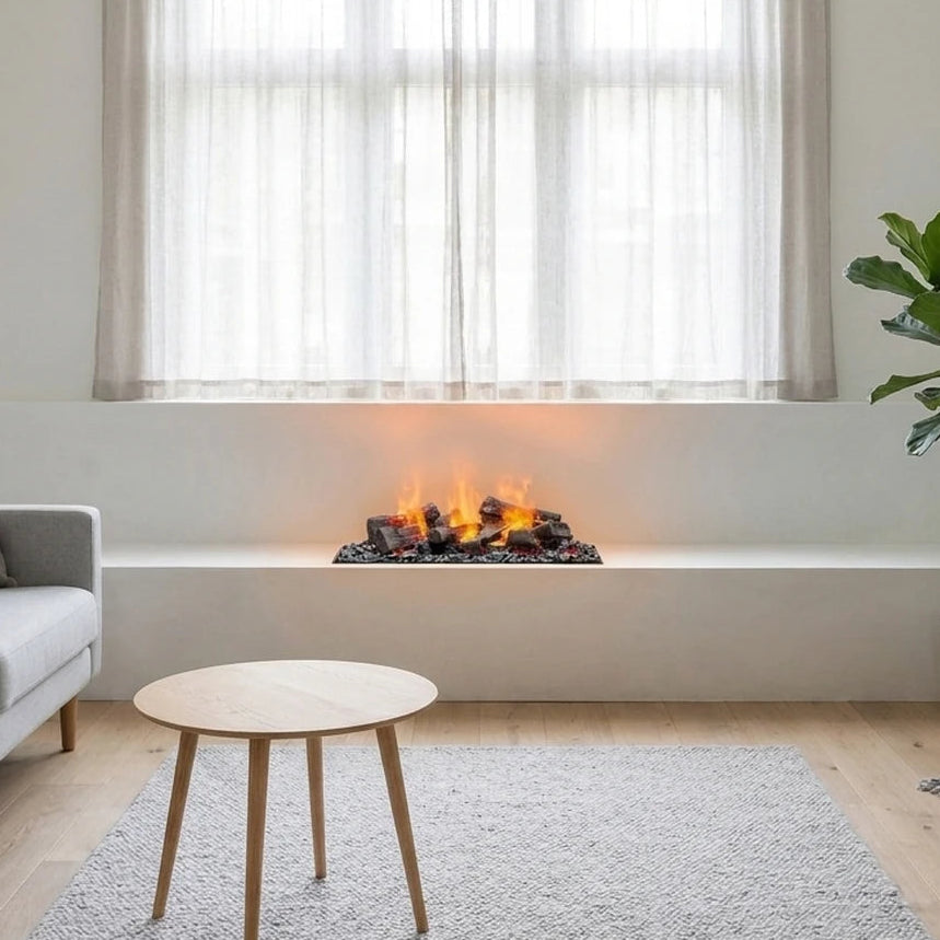 Small Dimplex Cassette 400-600 water vapour fireplace with decorative logs built into a white bench under a window in a bright living room with a sofa and coffee table